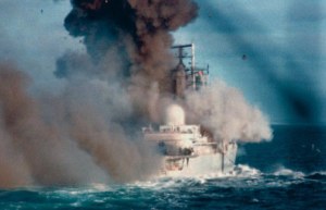 The HMS Coventry takes a missile during the 1982 Falklands war between the United Kingdom and Argentina.  Picture source: http://www.dailymail.co.uk/news/article-2146731/Miranda-Harts-father-relives-terrifying-Falklands-ordeal-30-years-ship-HMS-Coventry-sank-war.html