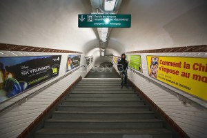 Man descending stairs, Abbesses Metro Station, line 12, Paris, France